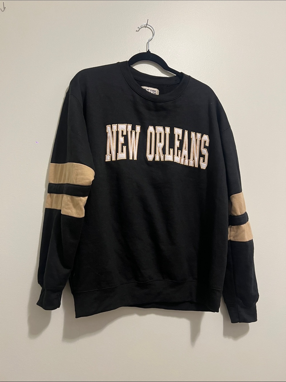 Black New Orleans Crewneck Sweatshirt with Tan Sleeve Stripes